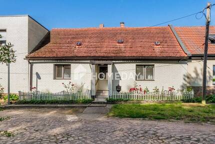 Sanierungsbedürftiges Reihenmittelhaus mit Nebengebäuden und Potenzial in ruhiger Lage von Beidersee